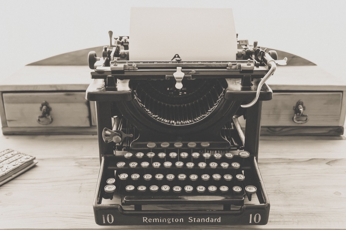 Old typewriter keys and paper conveying foundational message